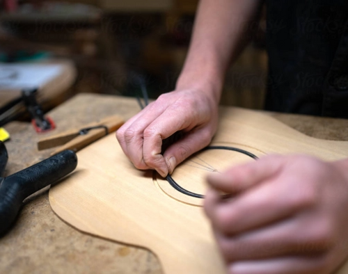 Carving wooden guitar frame